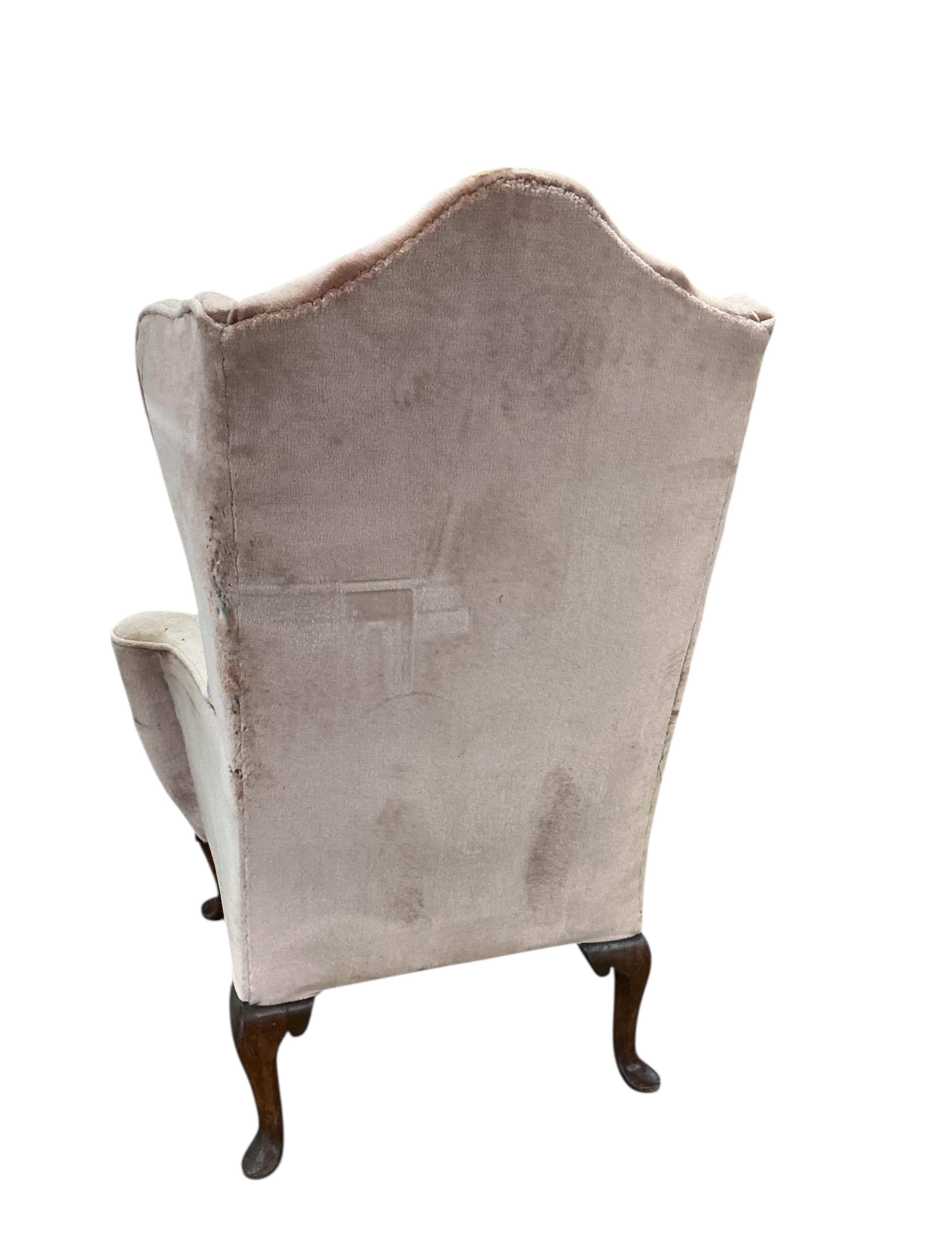 A Queen Anne Revival upholstered wing armchair, width 79cm, depth 60cm, height 116cm